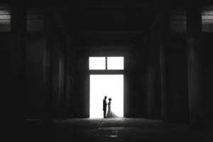 Cinematic silhouette of a wedding couple in a modern industrial venue in Mexico by Poga Studios.