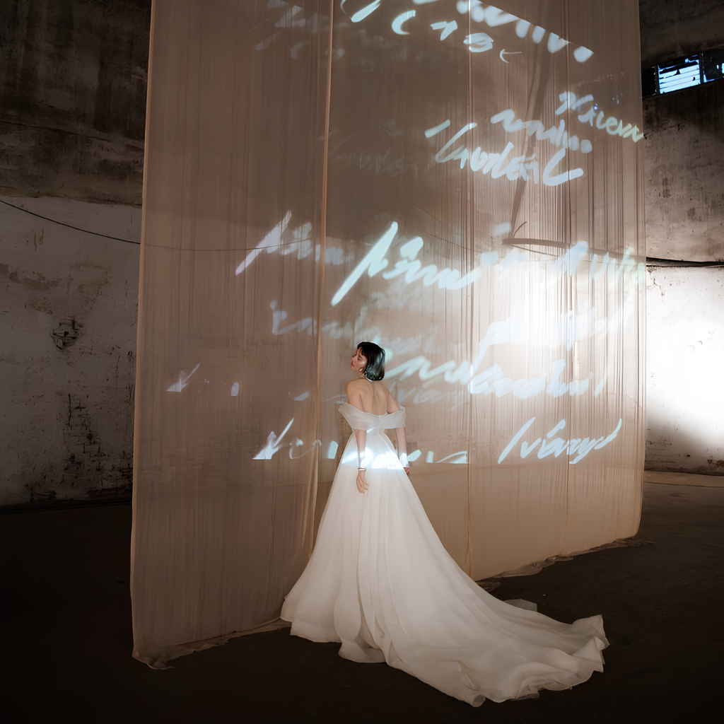 Bride standing next to aprojection maping during the recepcion